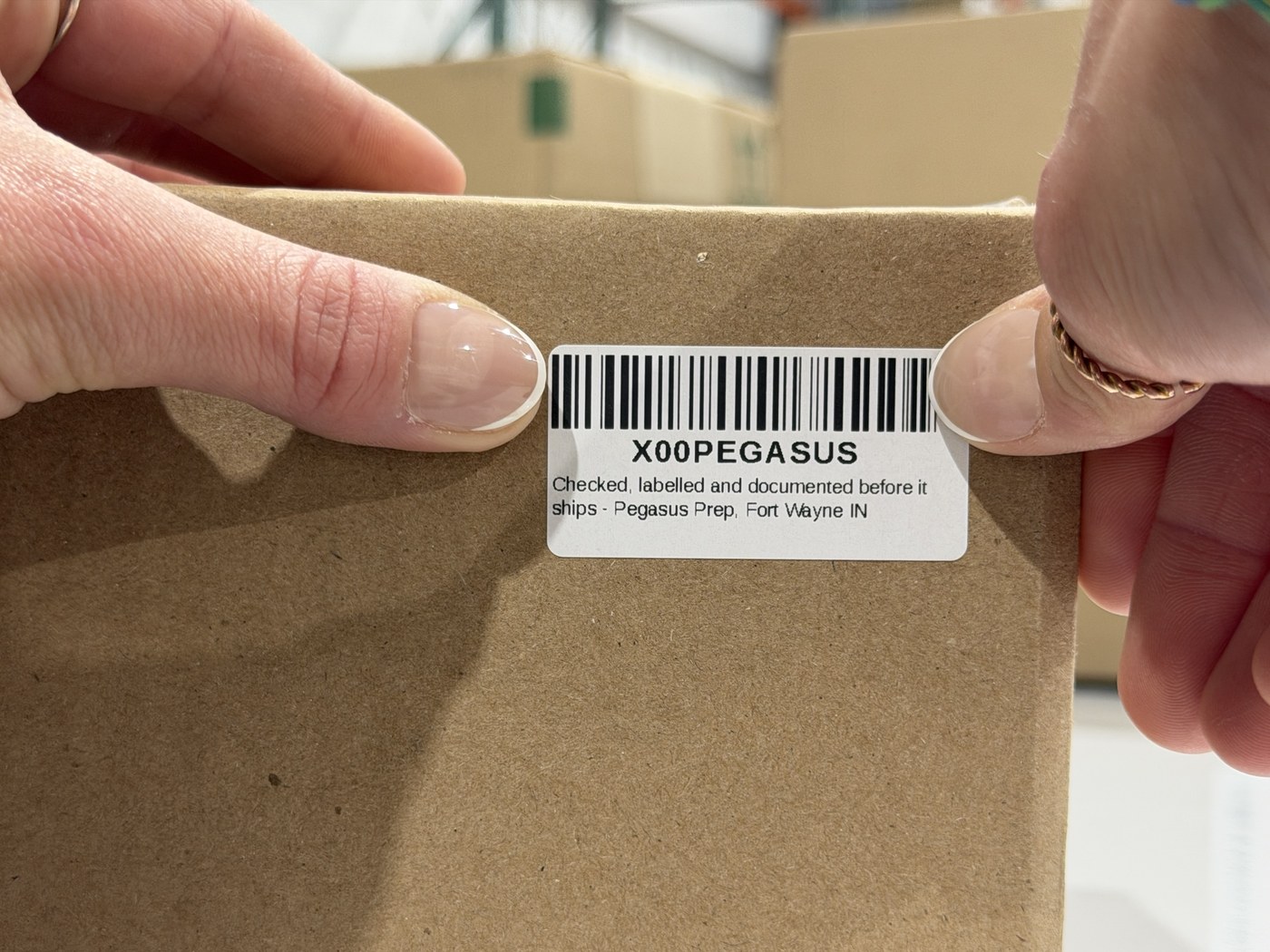 An FNSKU label applied to a carton before it ships into Amazon FBA